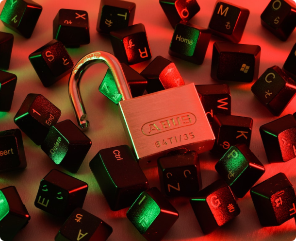 A group of keys with a padlock on them.