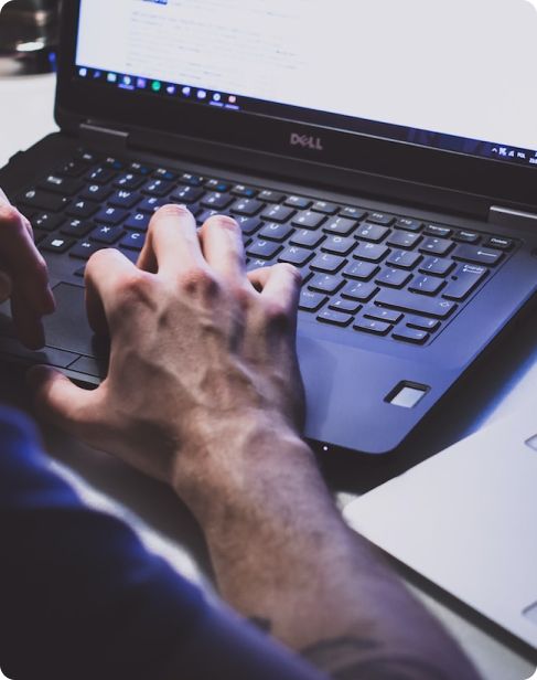 A person typing on a laptop.